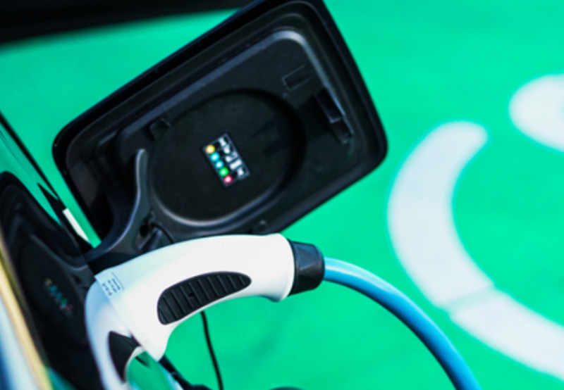 A charging lead plugged into a electric vehicles socket